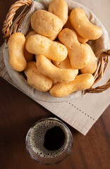 Brazilian starch biscuit in a basket( biscoito polvilho made with tapioca or cassava flour ). Top View, flat lay of Typical Brazilian biscuit