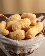 Brazilian starch biscuit in a basket( biscoito polvilho made with tapioca or cassava flour ). Typical Brazilian biscuit