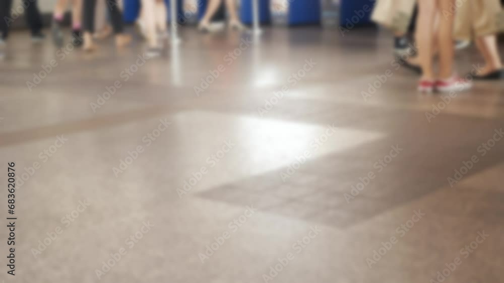 Canvas Prints defocused blurred low angle view to feet with crowd of people moving travel on the transition to the