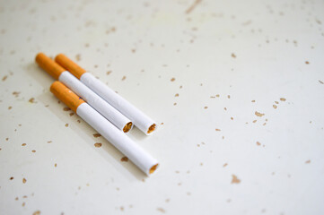 Close up of a cigarettes . Cigarette filter tubes on wooden background.