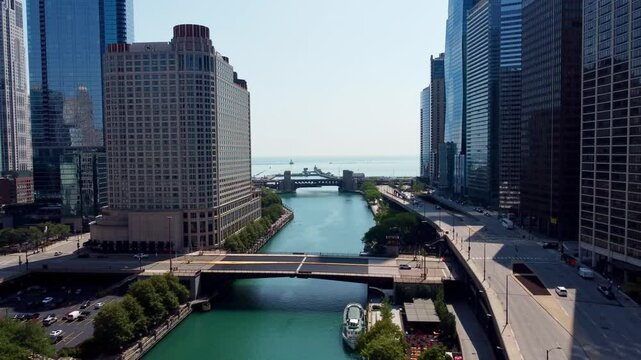 Drone shot of Chicago River and riverfront urban buildings in Chicago, Illinois, USA