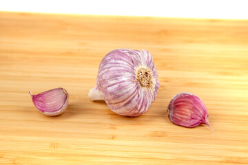 Purple garlic on a cutting board