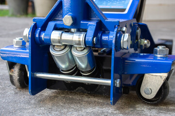 Fototapeta premium Double cylinder hydraulic system of car hydraulic floor jack , Car tools concept