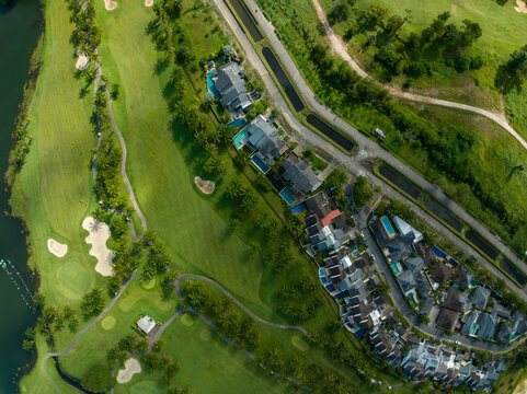 Aerial view of beautiful green golf field fairway and putting green,Top view image for sport background and travel nature background, Amazing green nature view