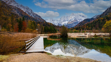 Autumn season with Jasna lake in Triglav national park at Kranjska Gora in Slovenia