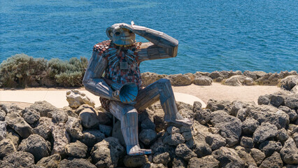 Giants of Mandurah "Sebas Song" sculpture sitting on the edge of Rockwall