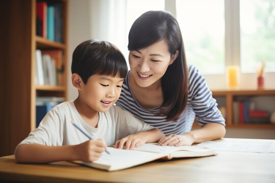 Mom helps son do homework sitting at table writing in notebook right answer. Girl asks mother to help with homework at table with laptop. Asian mom in cozy modern apartment helps daughter with lessons