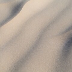 Fototapeta na wymiar Sand texture dunes desert pattern waves background close up beach tide ripples