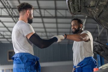 Auto mechanic craft team-building ritual, foster connection in a positive garage vibe for success.