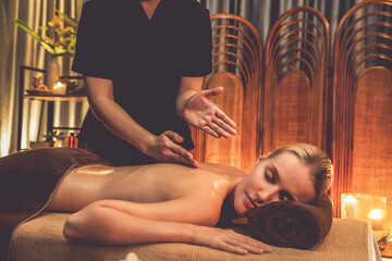 Caucasian woman customer enjoying relaxing anti-stress spa massage and pampering with beauty skin...