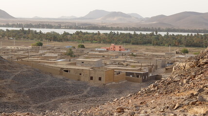 Photographing a rural village in northern Sudan from the top of the mountain