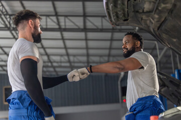 Auto mechanic craft team-building ritual, foster connection in a positive garage vibe for success.