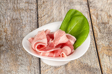 Sliced pork bacon in the bowl