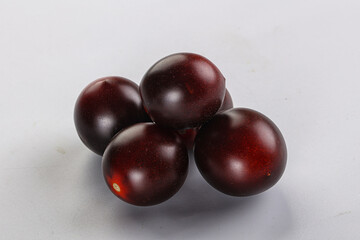 Raw ripe black kumato tomato