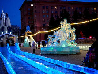 New Year's ice slides on the square in the evening with illumination