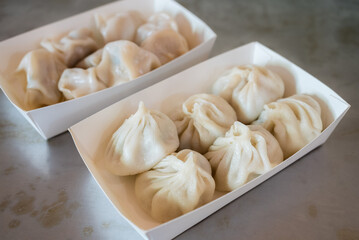 Steamed pork meat soup bun in the take away box