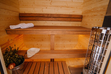 Small home wooden sauna, spa room. Relax in a hot sauna.