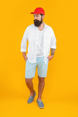 full length of stylish caucasian man isolated on yellow. stylish caucasian man in studio.