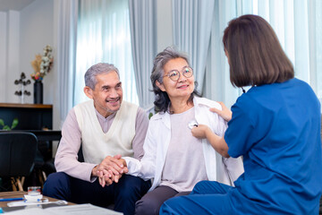 Fototapeta premium Senior couple get medical service visit from caregiver nurse at home while having medical checkup on heart and cardiovascular system for health care and pension welfare insurance concept