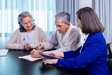 Asian senior couple signing legal financial contract and insurance health care benefit for retirement home visit service by professional lawyer consultant