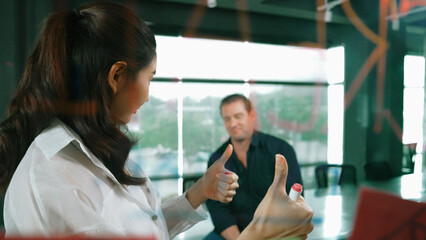 Young confident businesswoman present project to expert investor. Professional project manager uses sticky notes to explain startup project, sharing brainstorming ideas to investor. Manipulator.