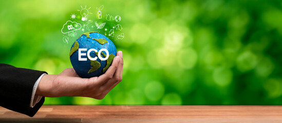 Businessman's hand holding Earth globe symbolize corporate commitment to ESG to reduce carbon...