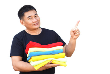 Handsome Asian man hold folded colorful clothes, point finger up. White background. Concept, daily chore, household. Folded clothes for neat and clean. Maintenance and keep garments for sanitary.   