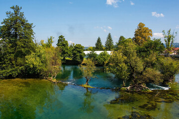 The River Una as it passes through central Bihac in Una-Sana Canton, Federation of Bosnia and...