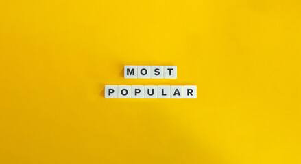 Most Popular Phrase on Alphabet Letter Blocks on Yellow Background. Minimal Aesthetic.