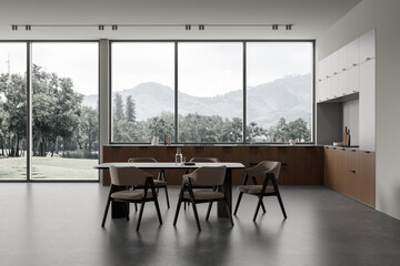 Gray kitchen interior with cabinets and table