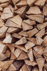 Wood texture. Logs on top of each other. Village woodshed. Wood for heating the house. Christmas background.