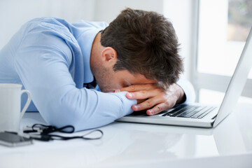 Businessman, sleeping and tired at work, burnout and exhausted or mental health, desk and...