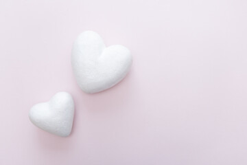 Fototapeta premium white Foam heart base for Arts and Crafts Supplies on a pale pink background