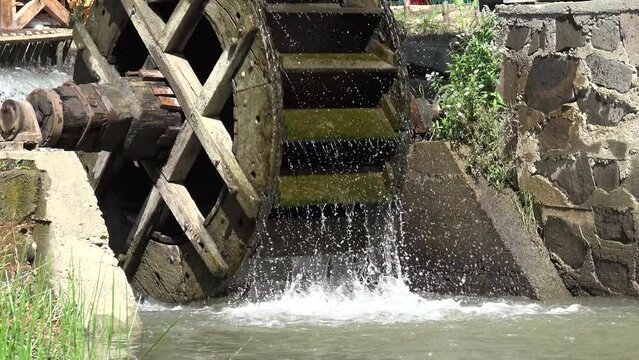 Working Wooden Wheel, Green Energy, Watermill Waterfall on River in Village