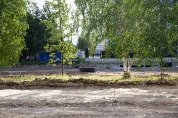 Repair of the road in the center of the city of Noyabrsk on Yamal in summer in 2023