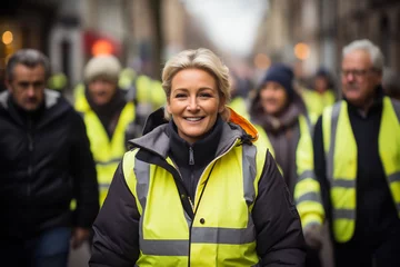 Foto op Canvas Portrait woman demonstration of the yellow vests walking in the street © AspctStyle