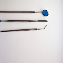 Dental tools on silver color background