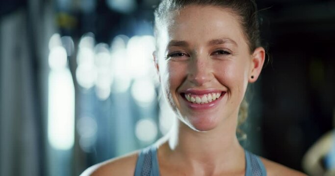 Happy, face and woman in gym for exercise, workout and laughing with fitness, health and wellness. Portrait, smile and athlete sweat in club for training, routine and confidence in sports challenge