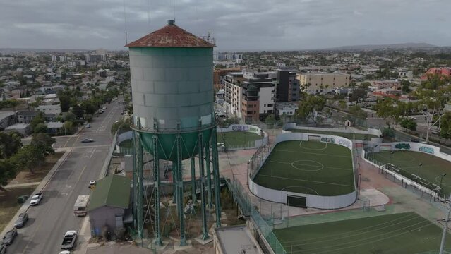 flying clockwise around iconic water tower of North Park San Diego