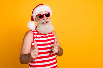 Photo of funky positive elderly guy wear new year swimsuit hat sunglass showing you empty space...