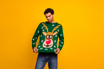 Photo of unsatisfied young person look christmas deer print sweater empty space isolated on yellow color background - obrazy, fototapety, plakaty
