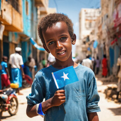 Somlian boy holding little somalia flag  - obrazy, fototapety, plakaty