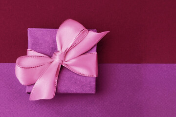 gift box with  bow on  paper background.