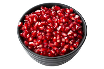 Pomegranate seeds in a bowl. File contains clipping path.