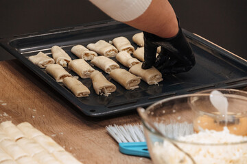 Baking process. The cook prepares the food.