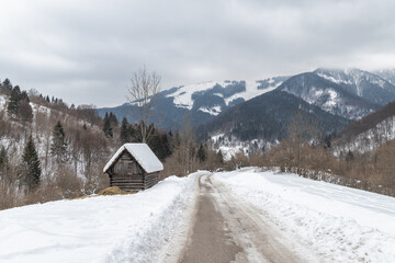 Road in a winter landscape with snowy mountains. Liptov region in Slovakia, Europe.