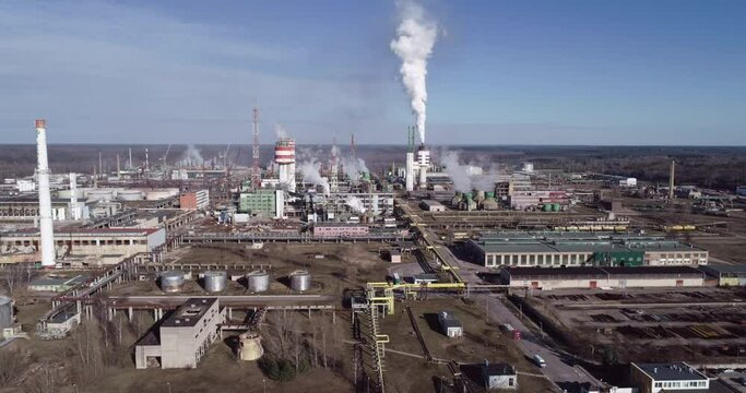 Chemistry Factory in Lithuania, Achema in Jonava City. Clear Blue Sky and Smoke Stacks in Background. Drone