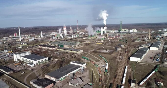 Chemistry Factory in Lithaunia, Achema in Jonava City. Clear Blue Sky and Smoke Stacks in Background. Drone
