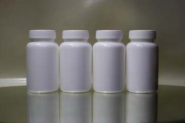 White plastic medical container Clearly for pills or capsules.Blank Slate