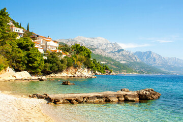 Blue sea of ​​Croatia and beautiful mountains. Landscape on a sunny day. Vacation concept